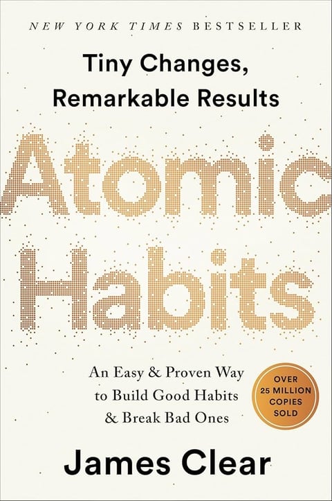 Book cover of Atomic Habits by James Clear, New York Times bestseller, showing pixelated gold text and a badge indicating over 25 million copies sold
