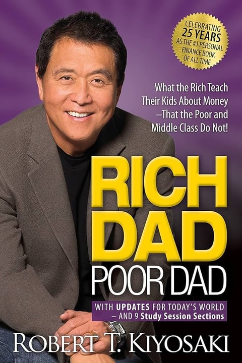 Book cover for Rich Dad Poor Dad by Robert T. Kiyosaki, featuring the author smiling against a purple background with gold title text and gold anniversary seal